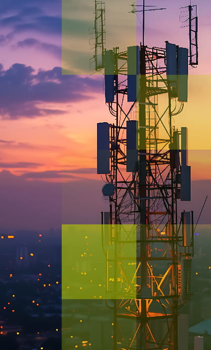 Telecom tower at sunset with city lights in background – representing Hogan Lovells’ landmark legal victory for Vodafone in one of the largest standalone competition cases in the English courts