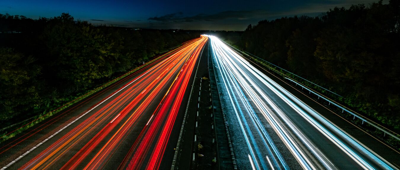 Long exposure of car lights going two directions on a highway at night