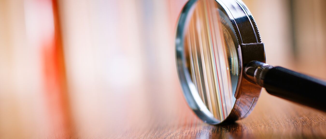 Close up, Single Magnifying Glass, Black Handle, Wooden Table, analysis