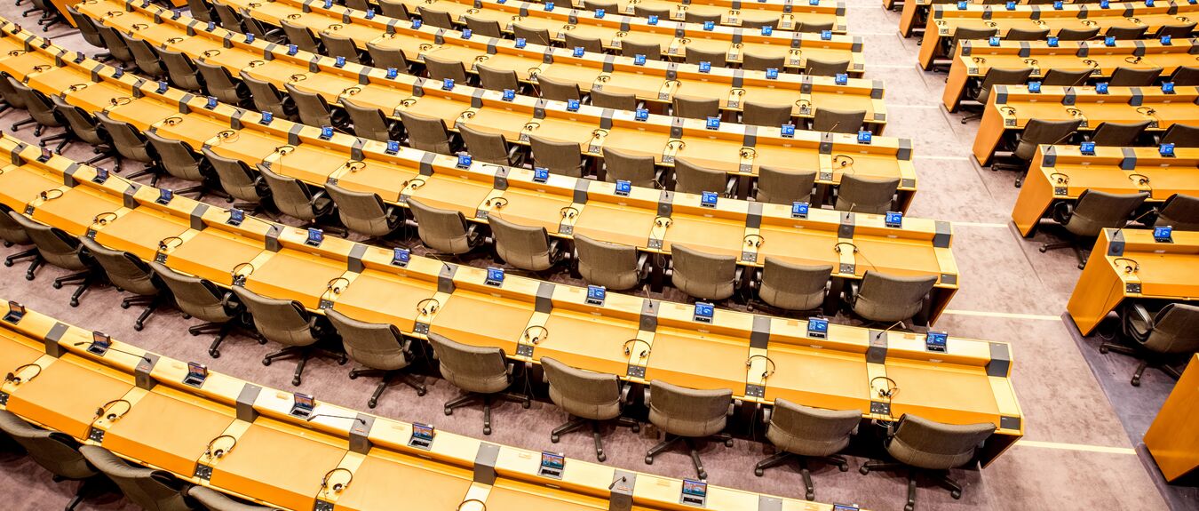 Interior meeting room lecture theatre European parliament Brussels, Belgium yellow chairs wide